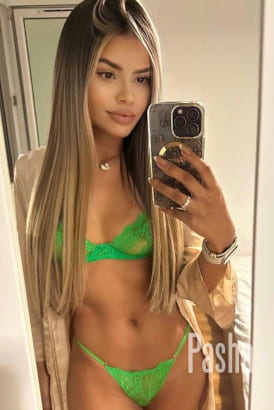 Hot young Brazilian girl taking a selfie in a lift