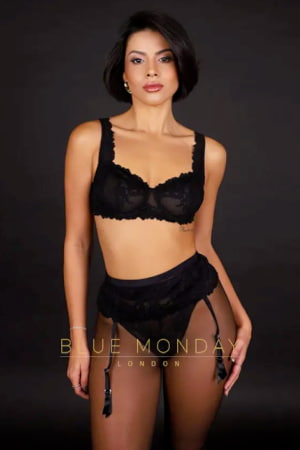Petite brunette Latin girl in a black bra