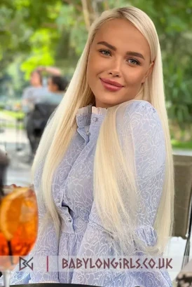 Gorgeous young blonde smiling into the camera lens