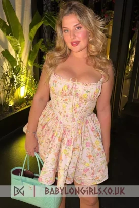 A hot curvy blonde in a cute short summer dress