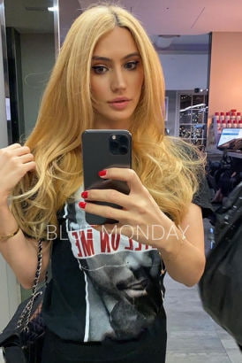 Stunning blonde taking a selfie in the gym