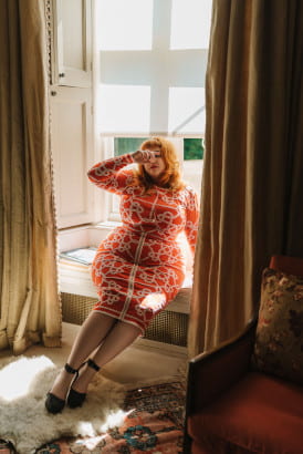 Curvy full figured BBW in a pink suit outfit