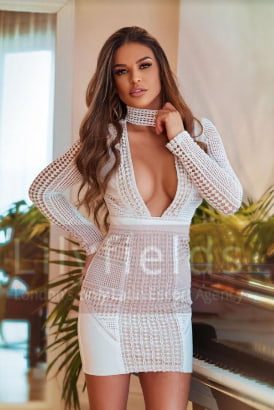 Busty Brazilian in a stylish white dress