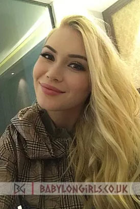 Very pretty young blonde smiling brightly taking a selfie