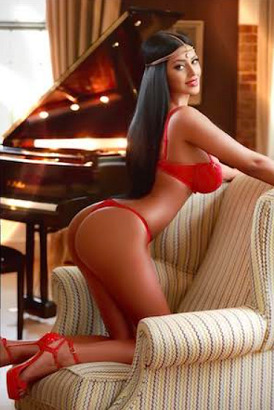 Escort with silky black hair in red lingerie