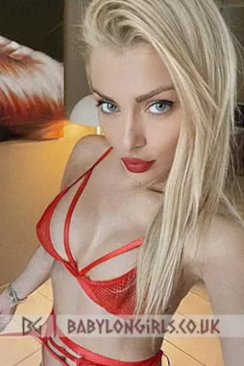 Skinny pretty blonde Lithuanian girl taking a close up selfie