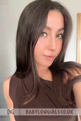 Close up of a pretty Italian brunette girl with green eyes