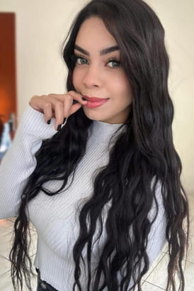 Young naturally busty dark haired girl with large green eyes